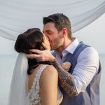 groom bride kissing