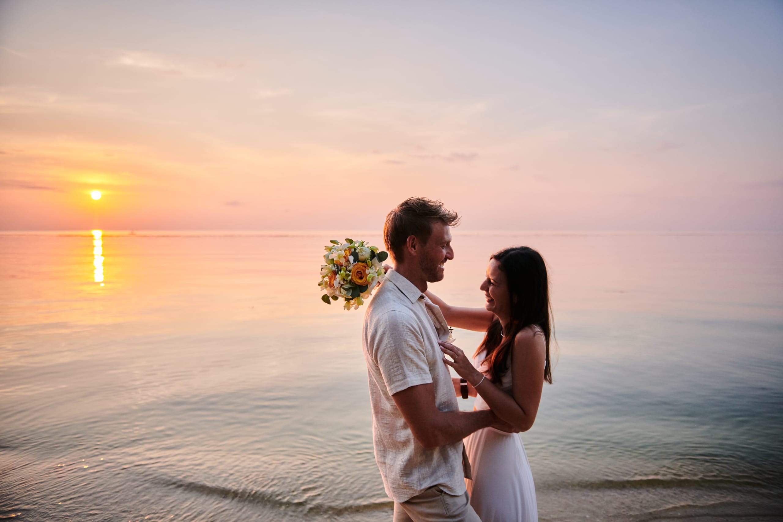beach wedding sunset couple shooting