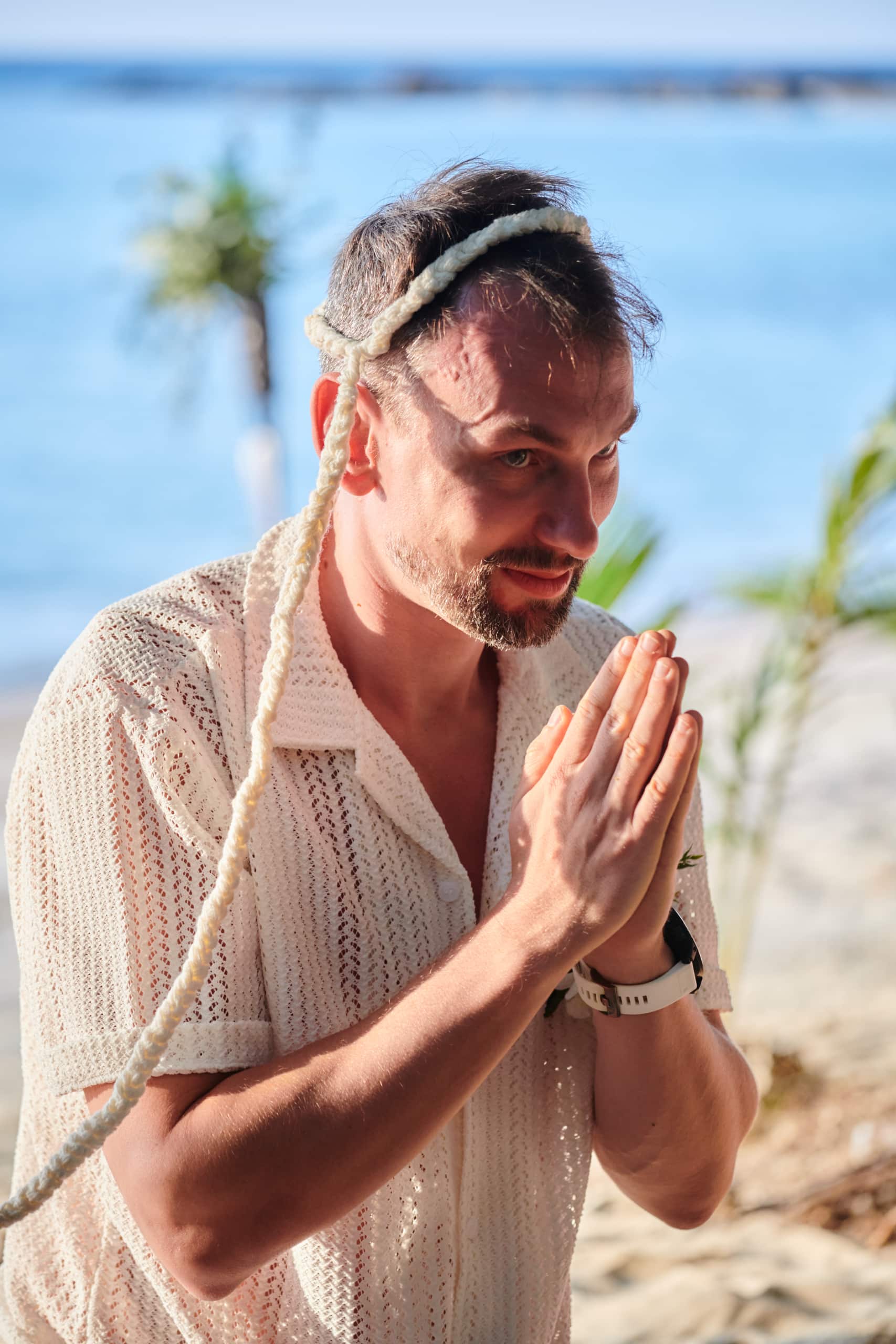 beach wedding monk blessing groom