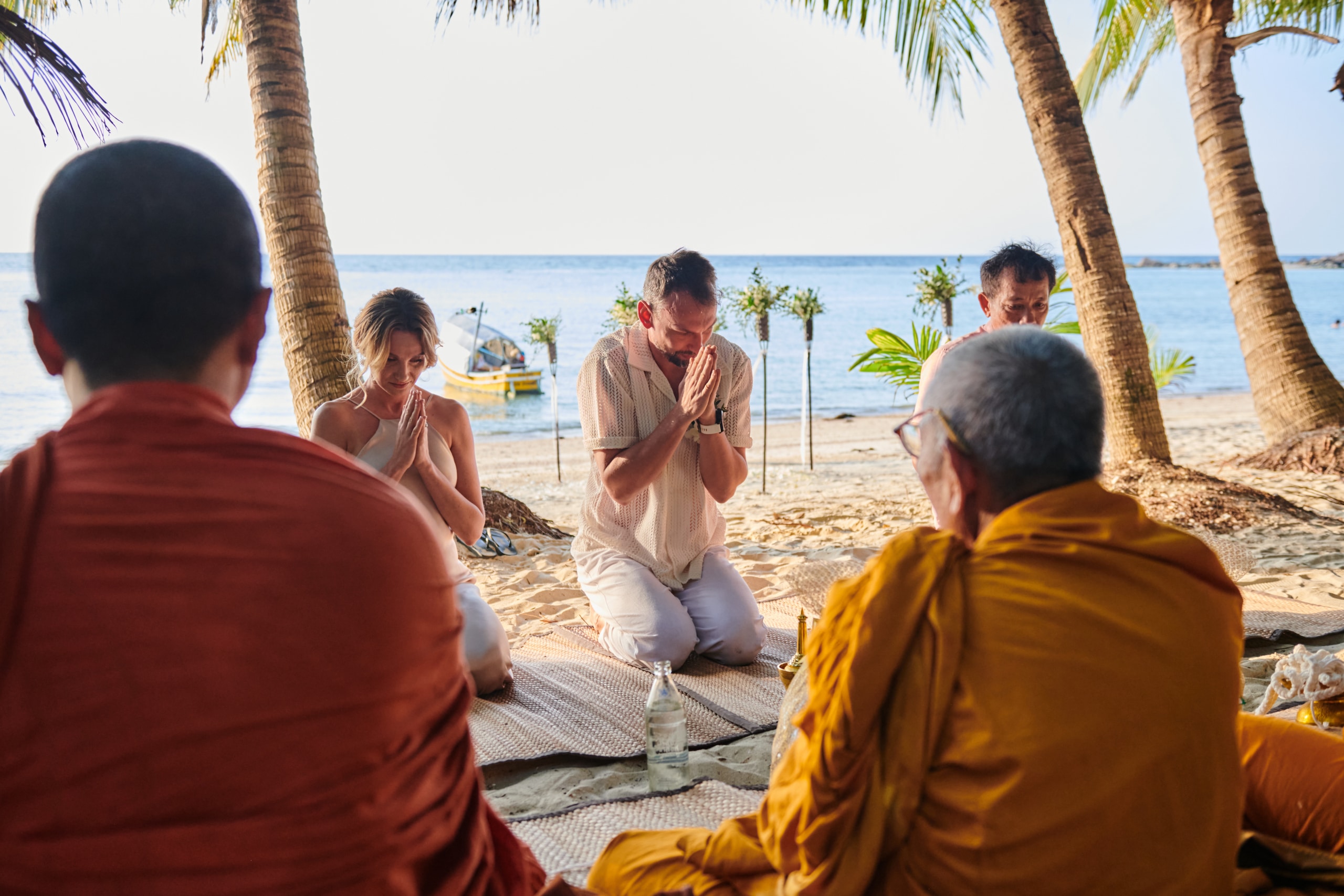 beach wedding monk blessing