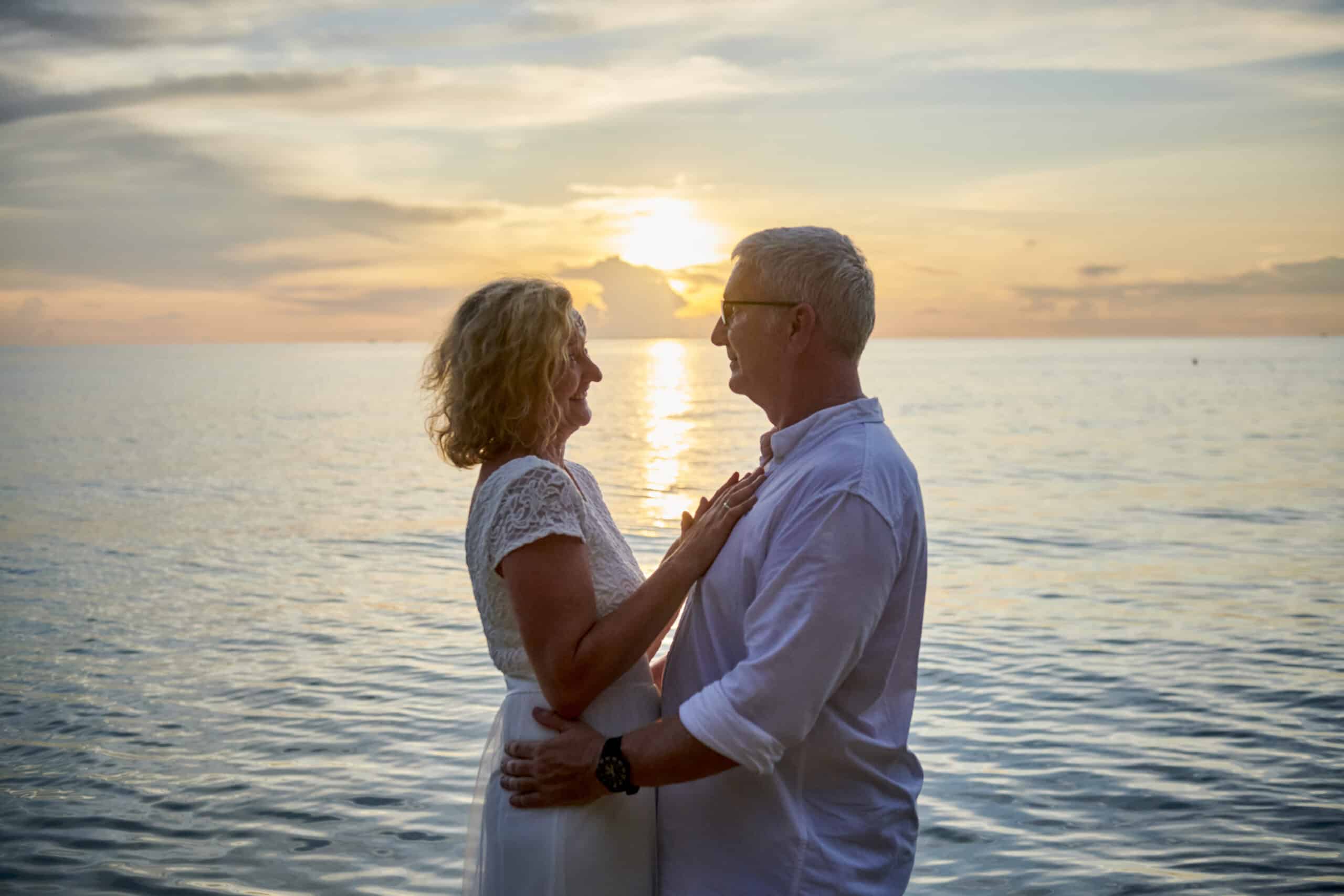 couple beach wedding sunset