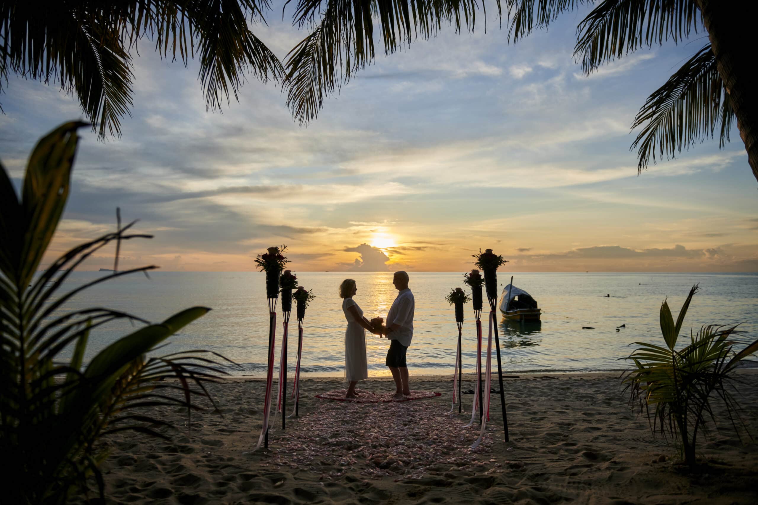 couple beach wedding sunset