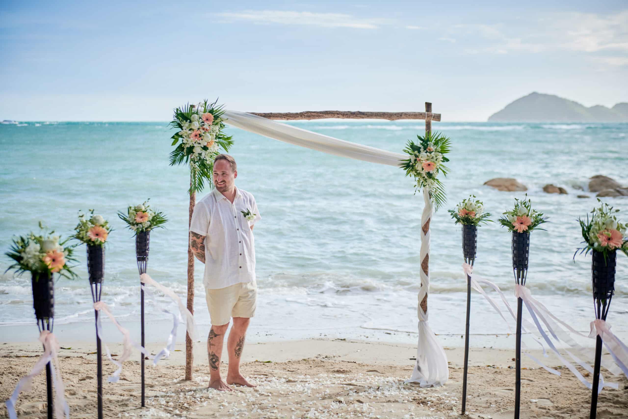 beach wedding ceremony groom