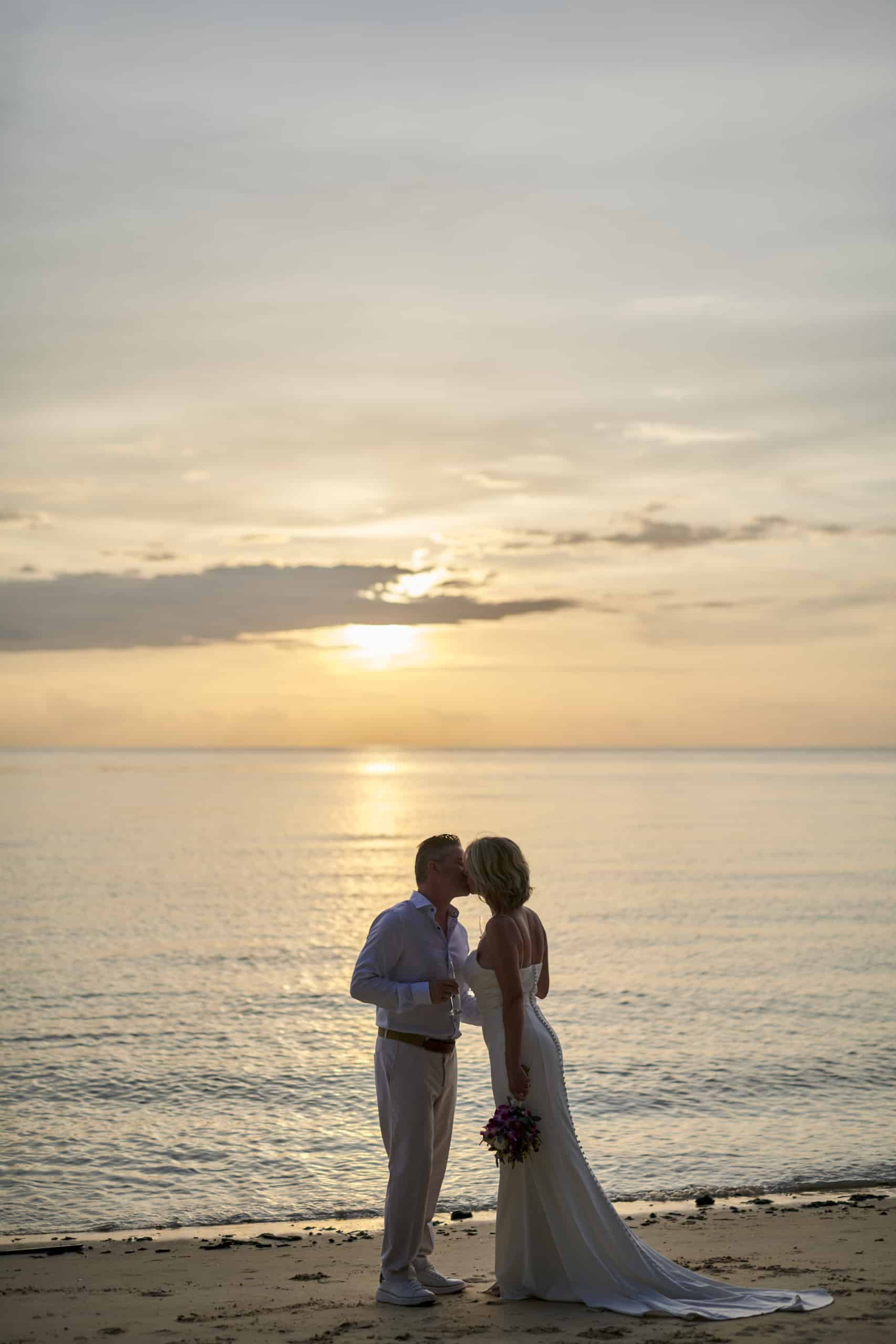 beach wedding couple sunset