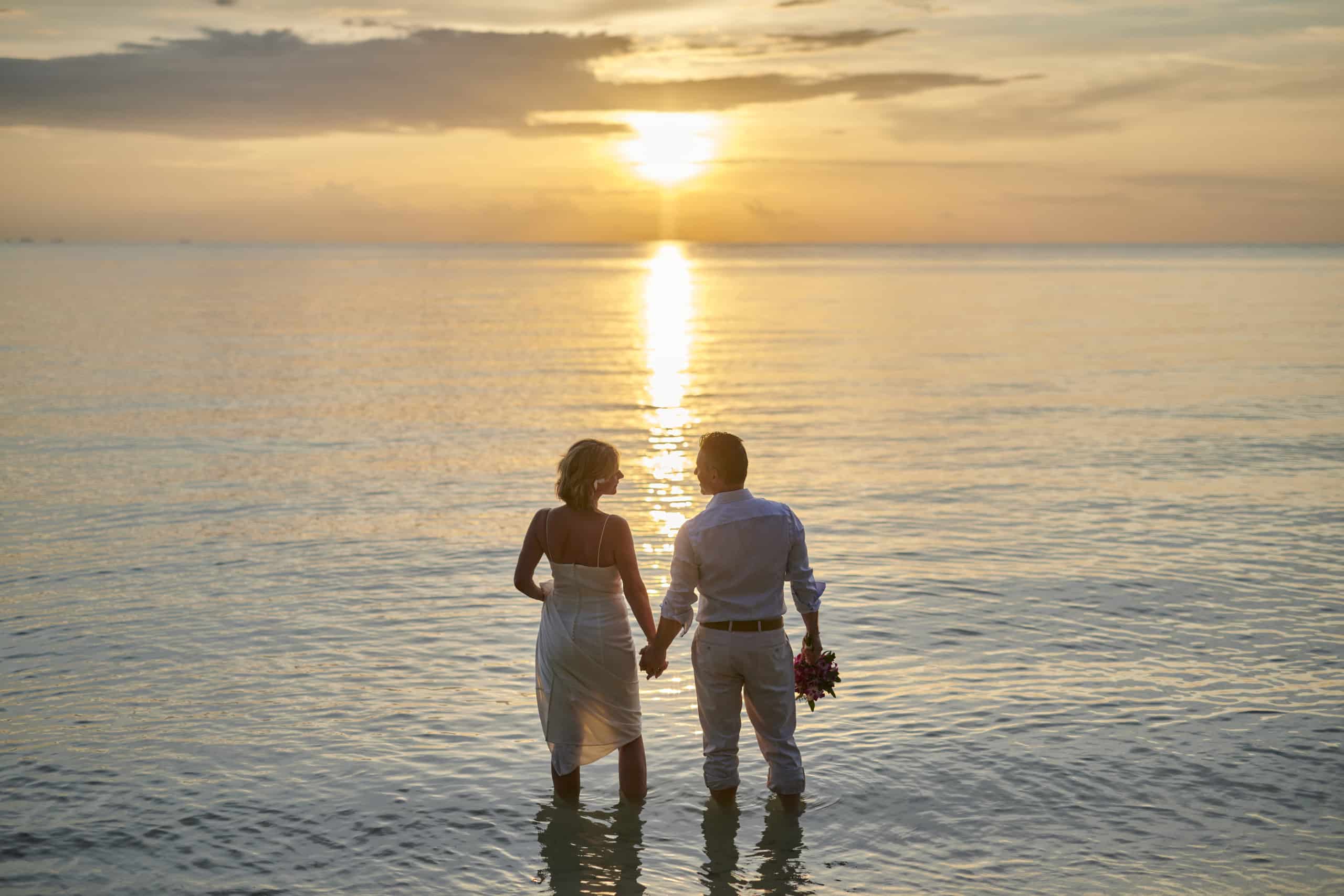 beach wedding couple sunset