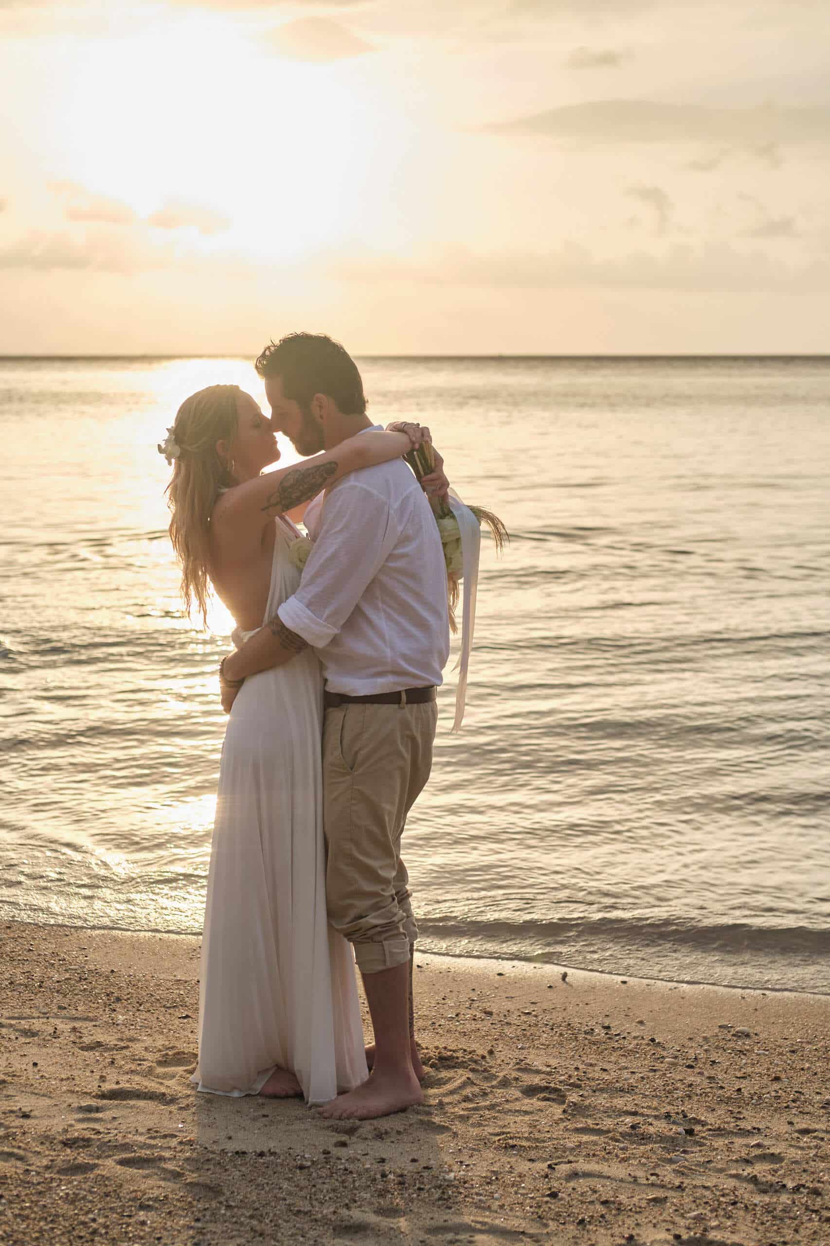 beach wedding couple shooting sunset