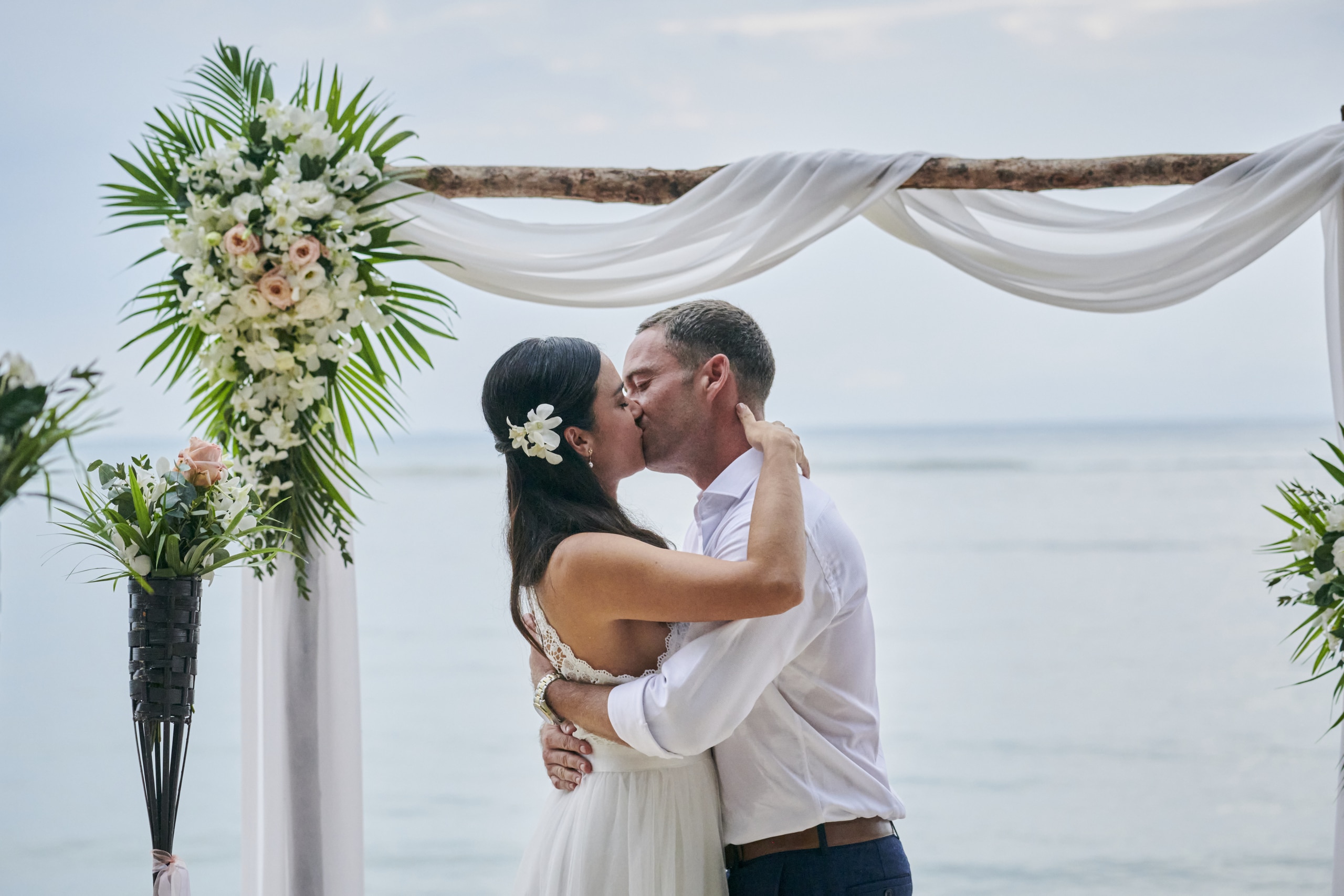 beach wedding couple kiss