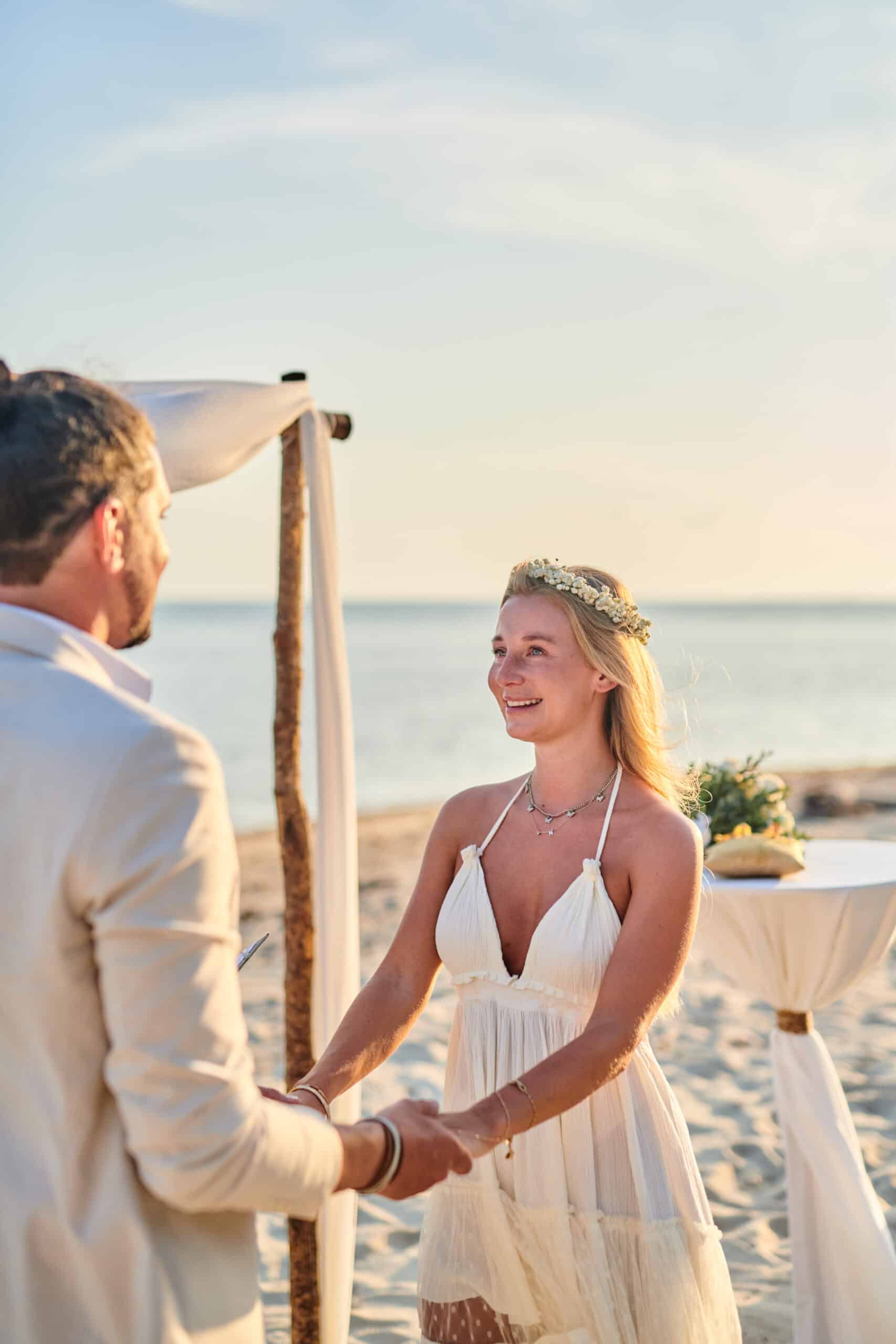 beach wedding ceremony bride