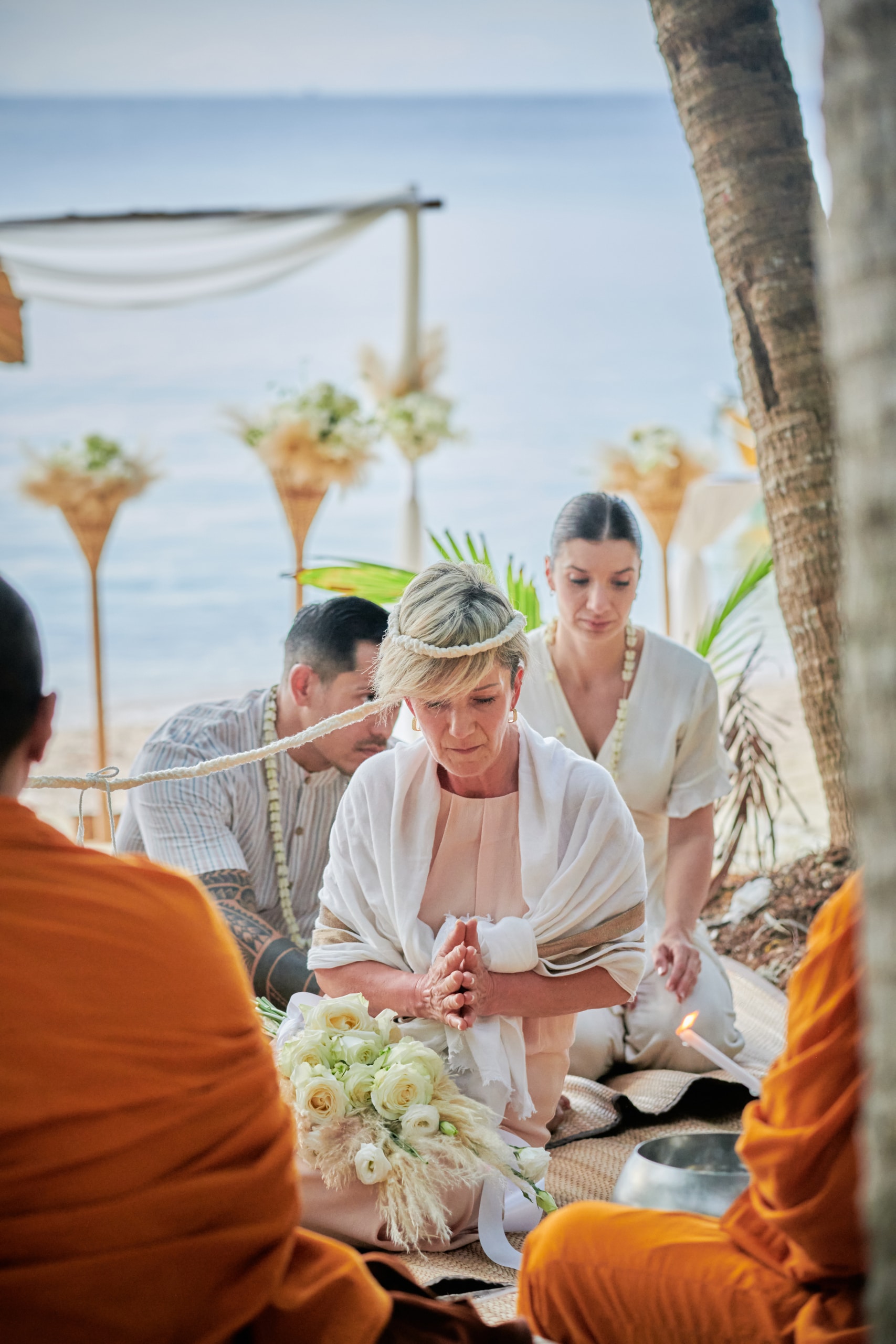 beach wedding monk blessing bride