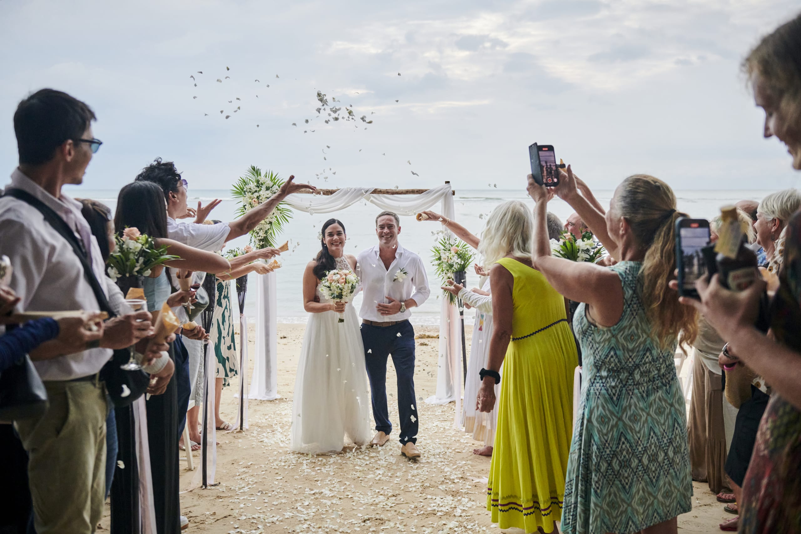 beach wedding celebration couple and guests