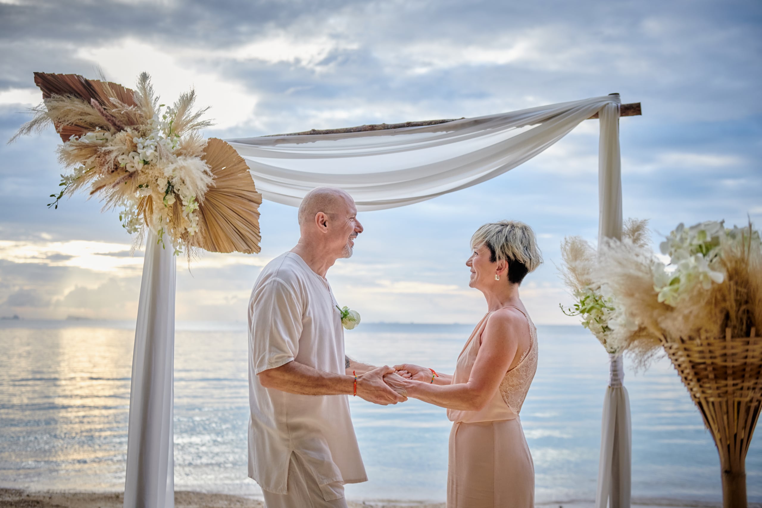 beach wedding ceremony couple